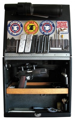 Pacymayr 5-gun box with original tray removed and replaced with a Red Oak insert for three pistols. Two more pistols could be fit onto the tray with different grip post configurations however the overall weight of the box could become quite cumbersome.