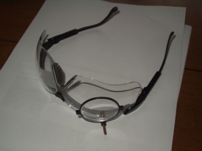 modified safety glasses with a piece of scotch tape to obscure the left eye vision.